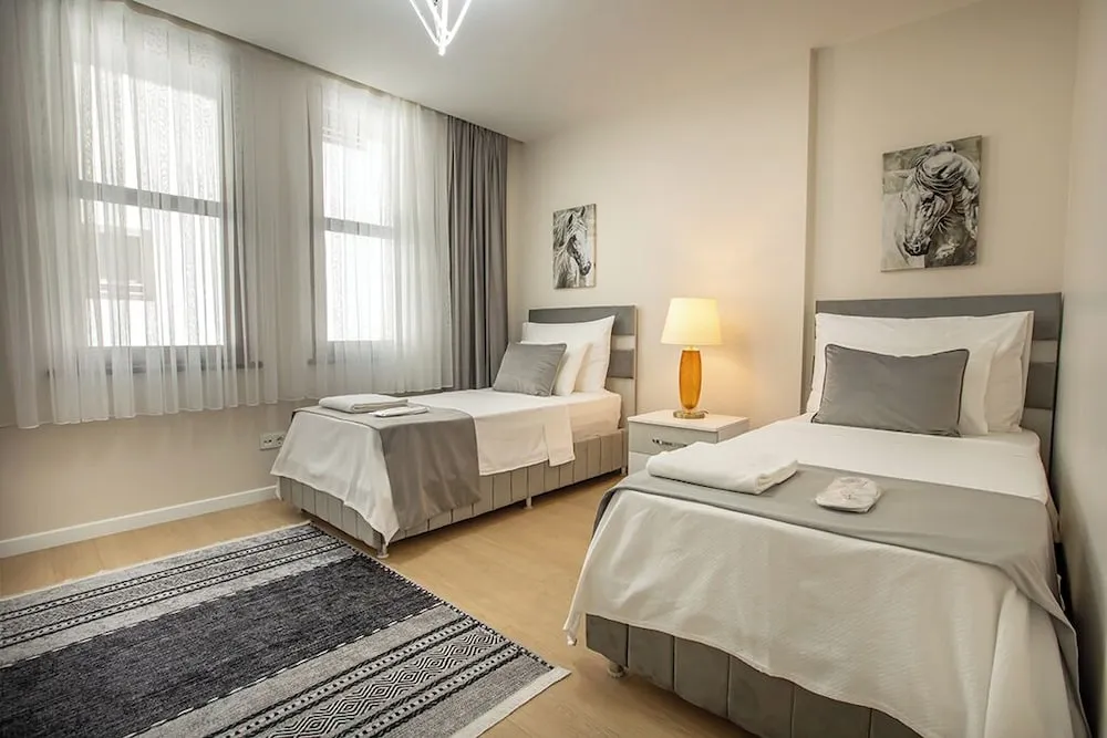 Executive Serviced Apartments with One King and Two Single Beds and a Private Balcony