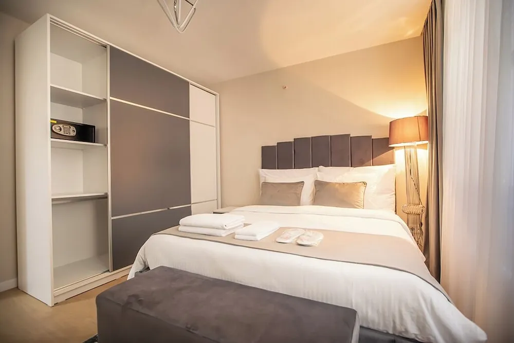 Executive Serviced Apartments with One King and Two Single Beds and a Private Balcony