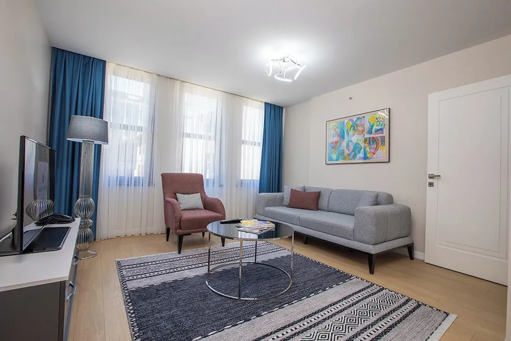 Executive Serviced Apartments with One King and Two Single Beds and a Private Balcony