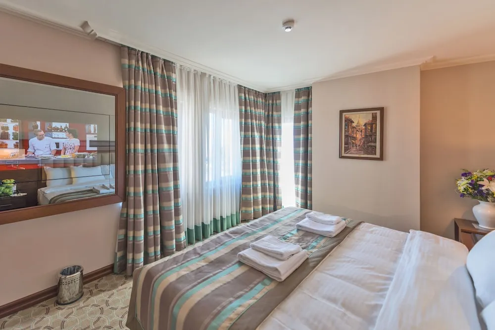 Deluxe Tek Büyük veya İki Ayrı Yataklı Oda