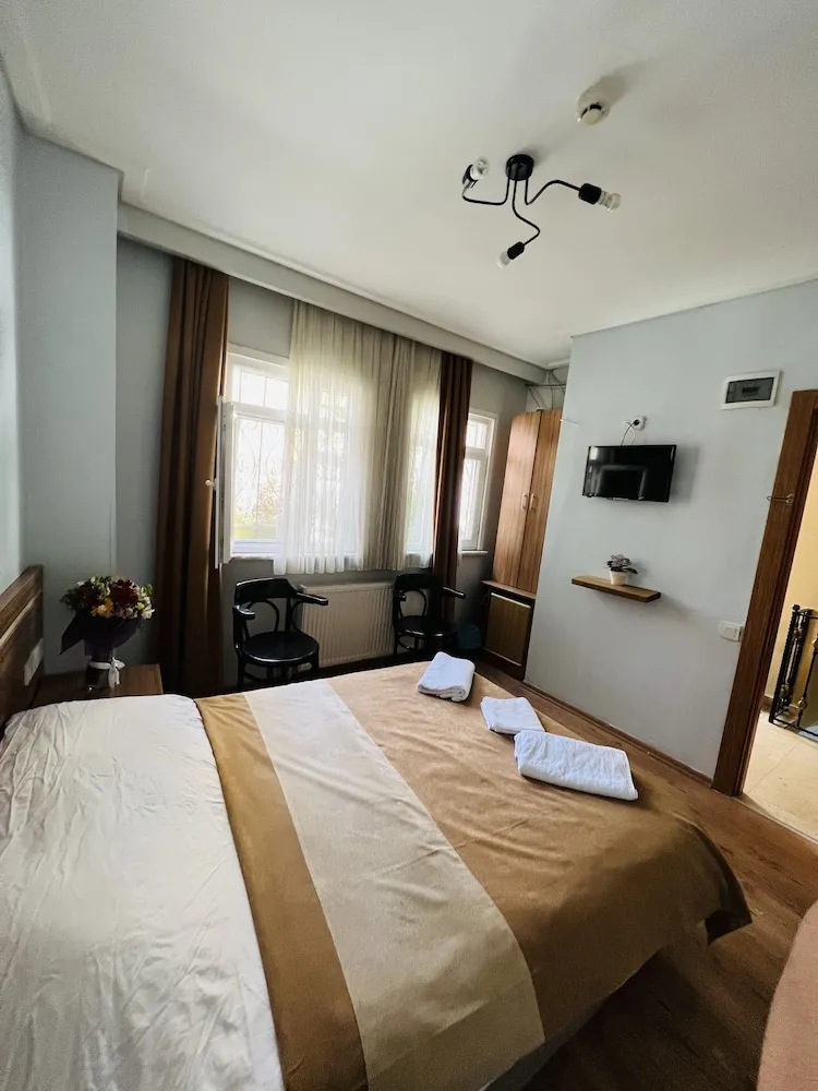 Deluxe Tek Büyük veya İki Ayrı Yataklı Oda
