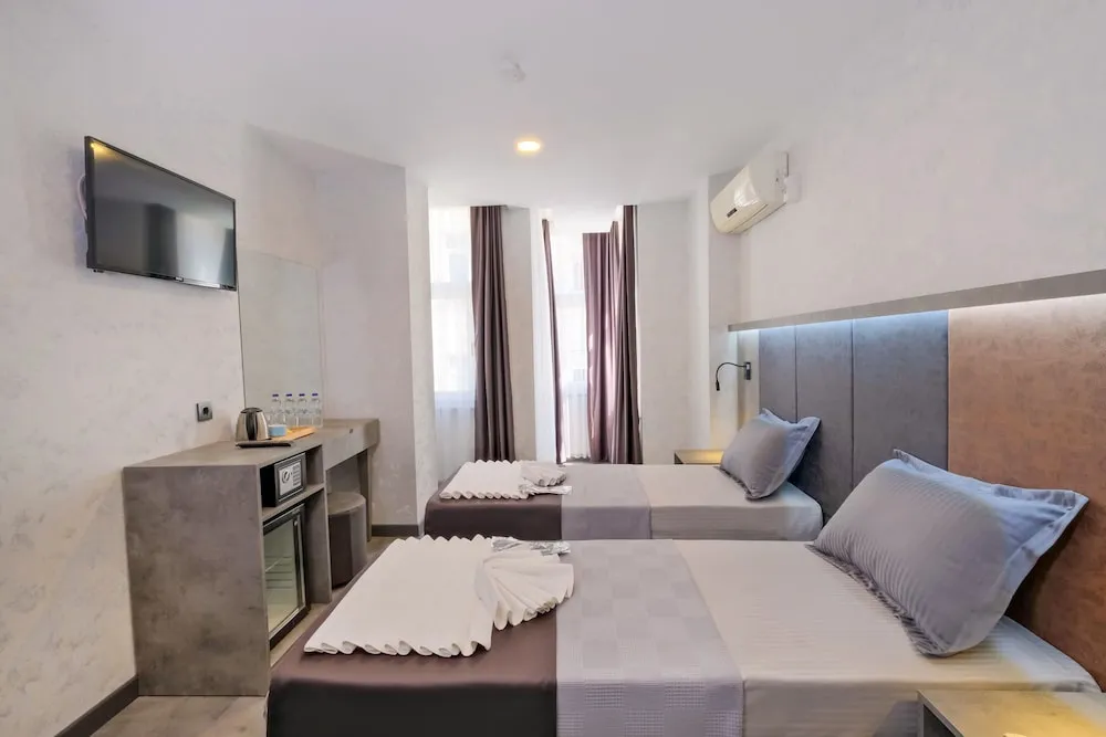 Deluxe Tek Büyük veya İki Ayrı Yataklı Oda