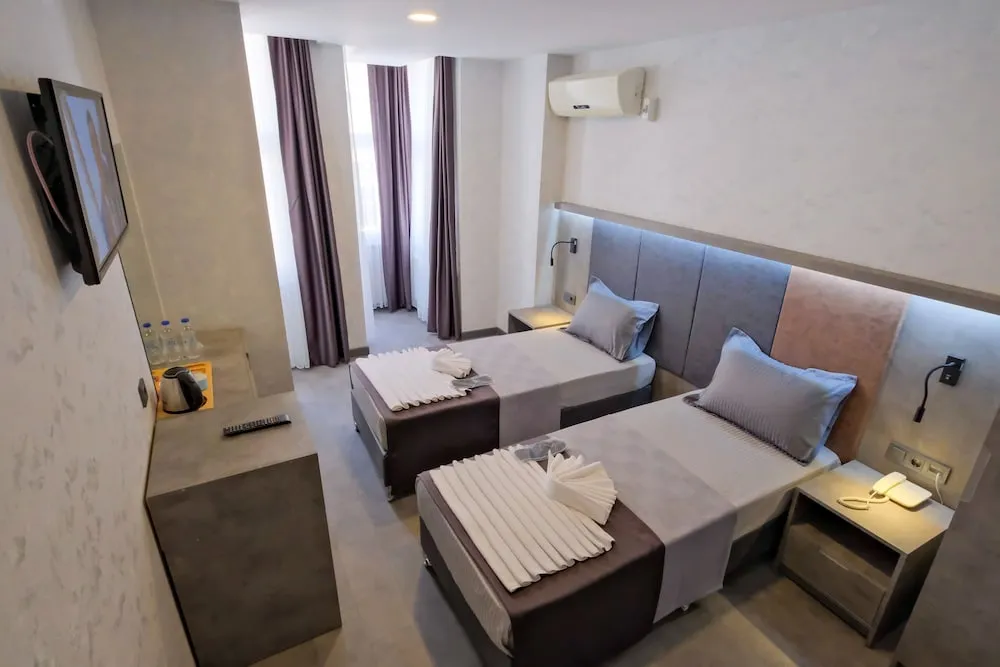 Deluxe Tek Büyük veya İki Ayrı Yataklı Oda