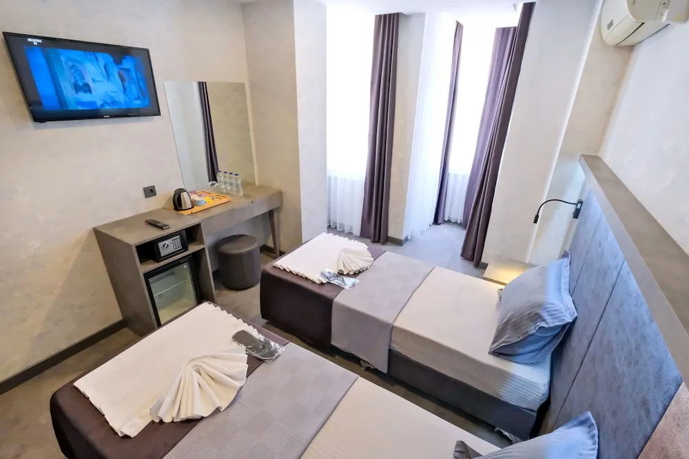 Deluxe Tek Büyük veya İki Ayrı Yataklı Oda