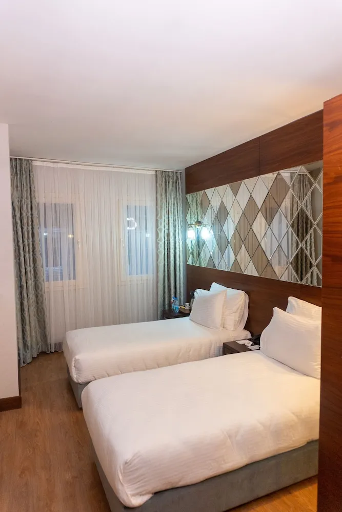 Deluxe Tek Büyük veya İki Ayrı Yataklı Oda
