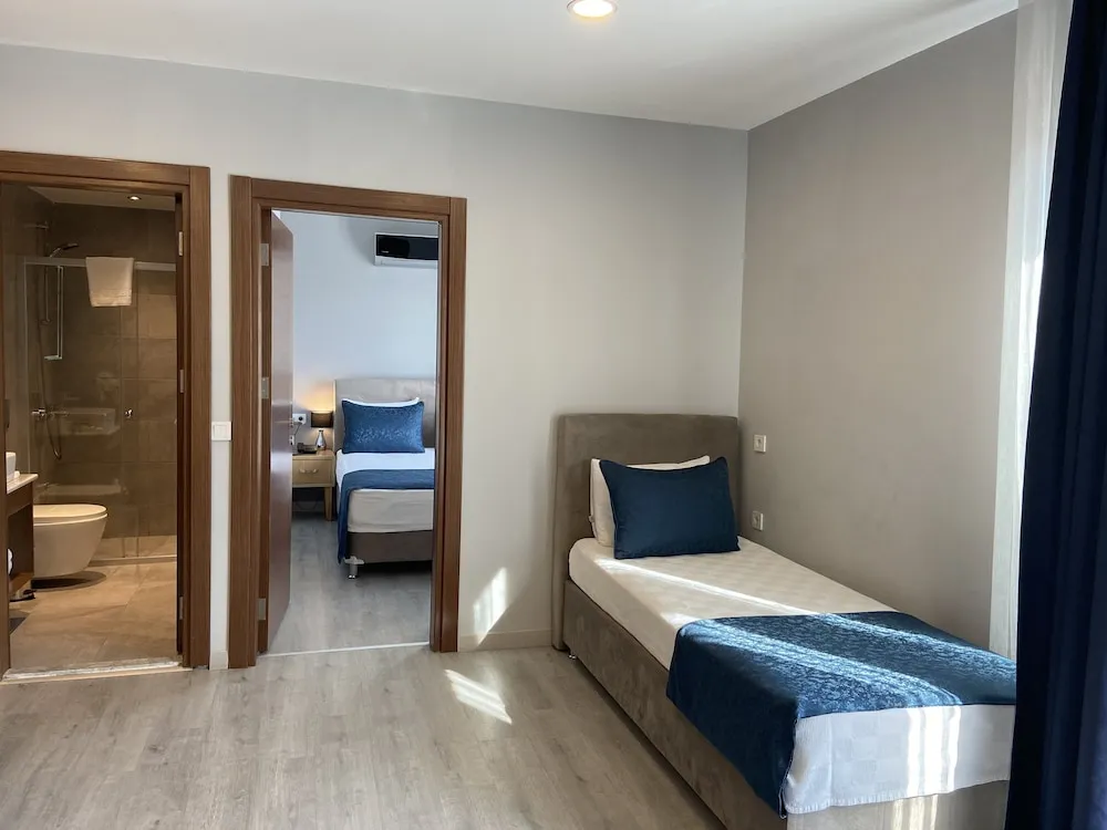 Business Üç Kişilik Oda, 1 Yatak Odası, Balkon/Veranda