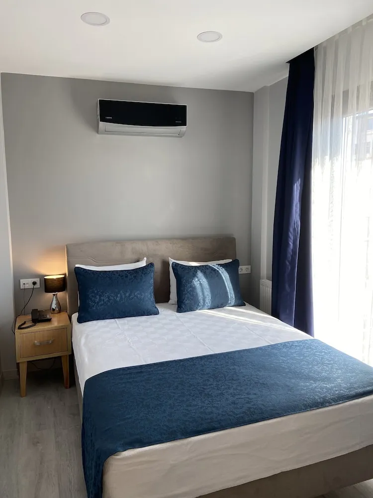 Business Üç Kişilik Oda, 1 Yatak Odası, Balkon/Veranda