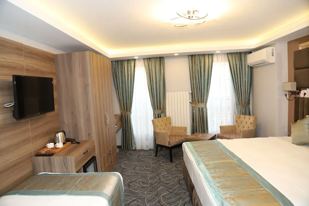 Deluxe Üç Kişilik Oda