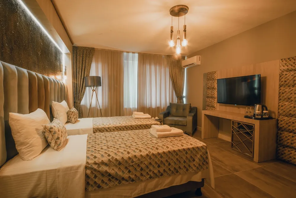 Deluxe Tek Büyük veya İki Ayrı Yataklı Oda