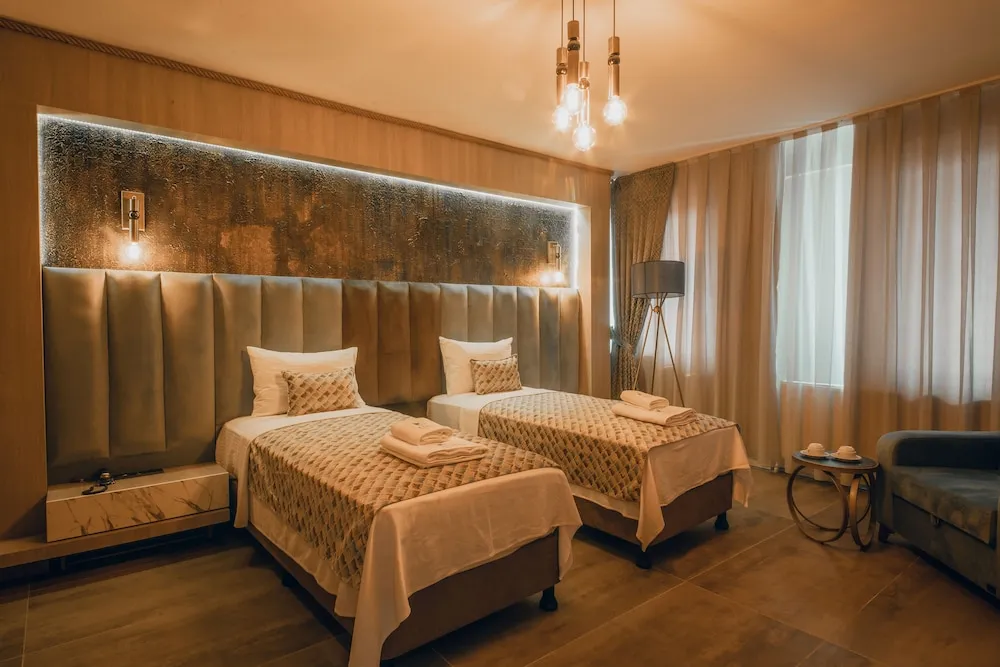 Deluxe Tek Büyük veya İki Ayrı Yataklı Oda