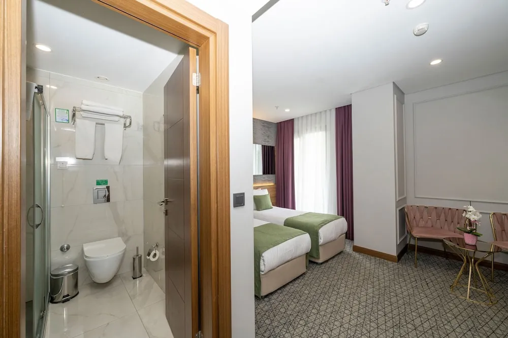 Deluxe Tek Büyük veya İki Ayrı Yataklı Oda