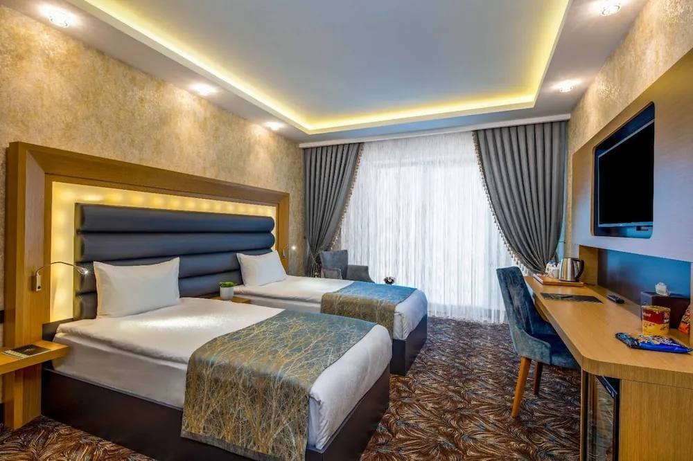 Deluxe Tek Büyük veya İki Ayrı Yataklı Oda