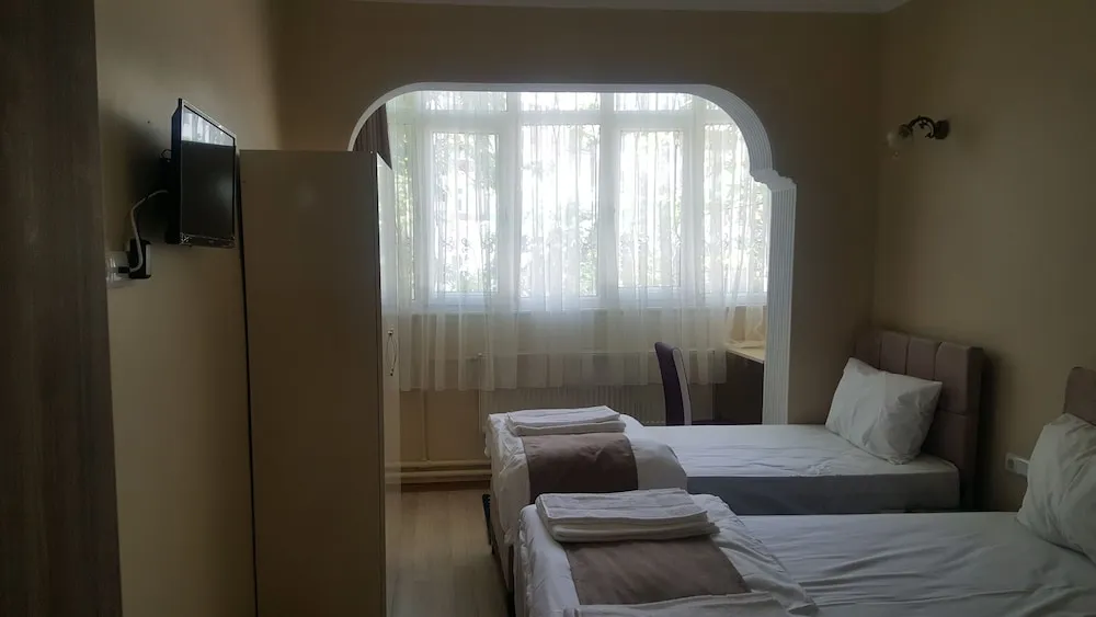 Üç Kişilik Oda