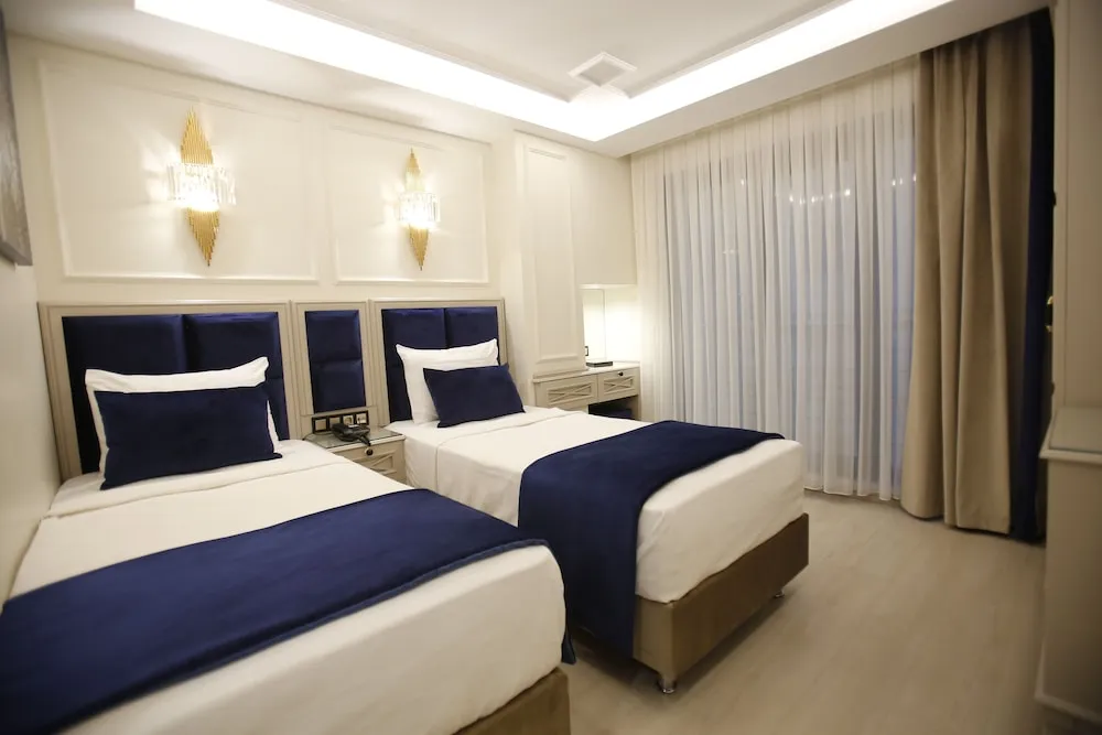 Deluxe Tek Büyük veya İki Ayrı Yataklı Oda