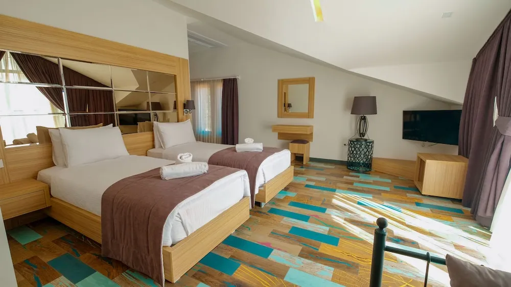 Deluxe Tek Büyük veya İki Ayrı Yataklı Oda