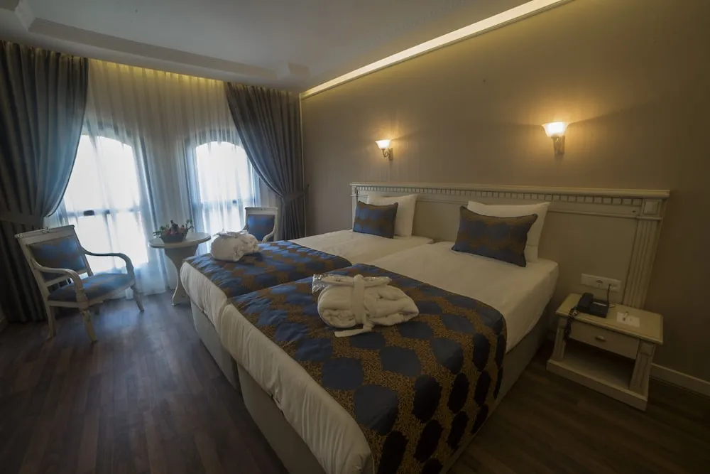 Deluxe Tek Büyük veya İki Ayrı Yataklı Oda