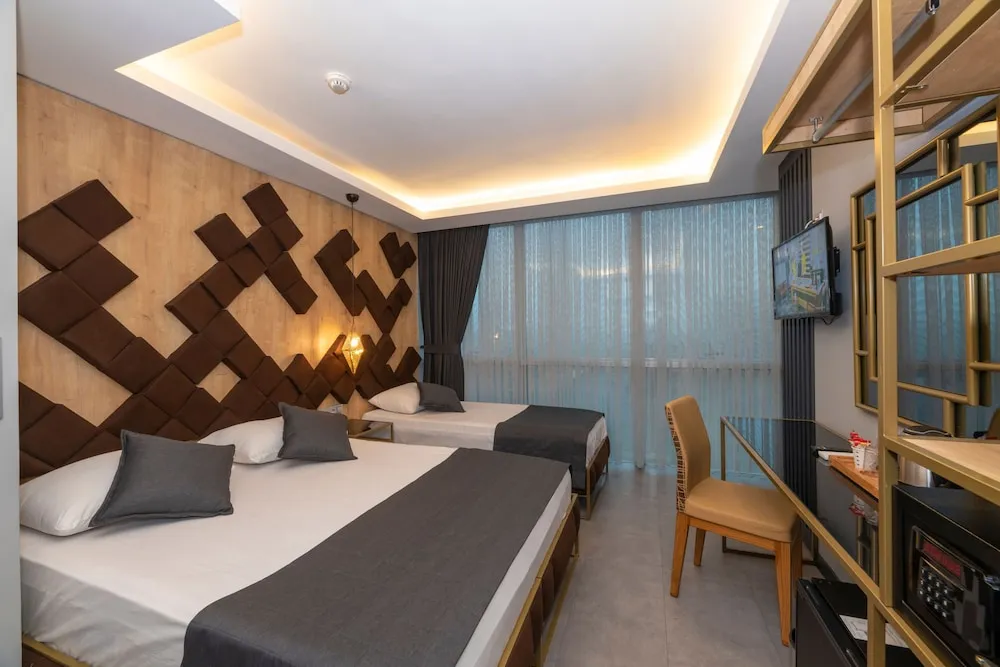 Deluxe Tek Büyük veya İki Ayrı Yataklı Oda