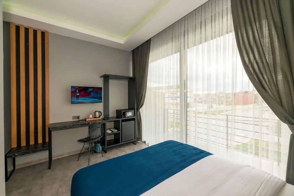 Deluxe Tek Büyük veya İki Ayrı Yataklı Oda, Balkon