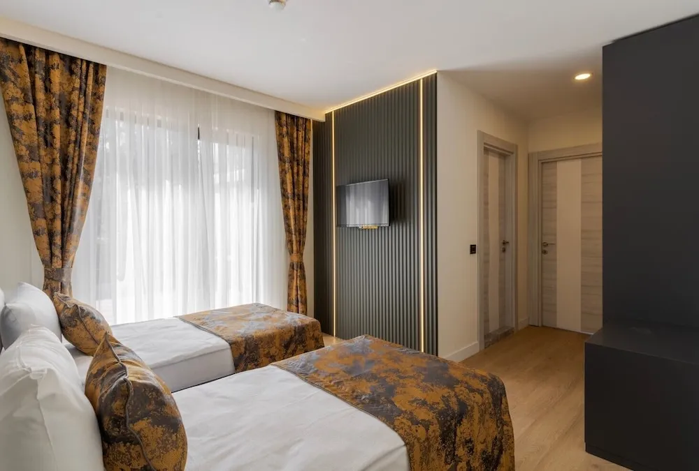 Deluxe Tek Büyük veya İki Ayrı Yataklı Oda