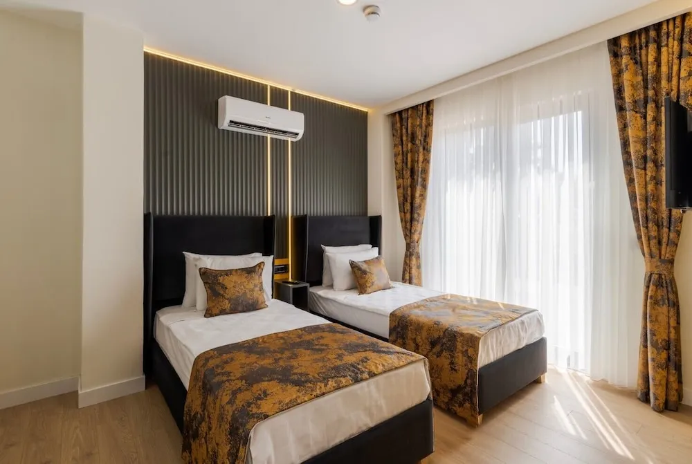 Deluxe Tek Büyük veya İki Ayrı Yataklı Oda