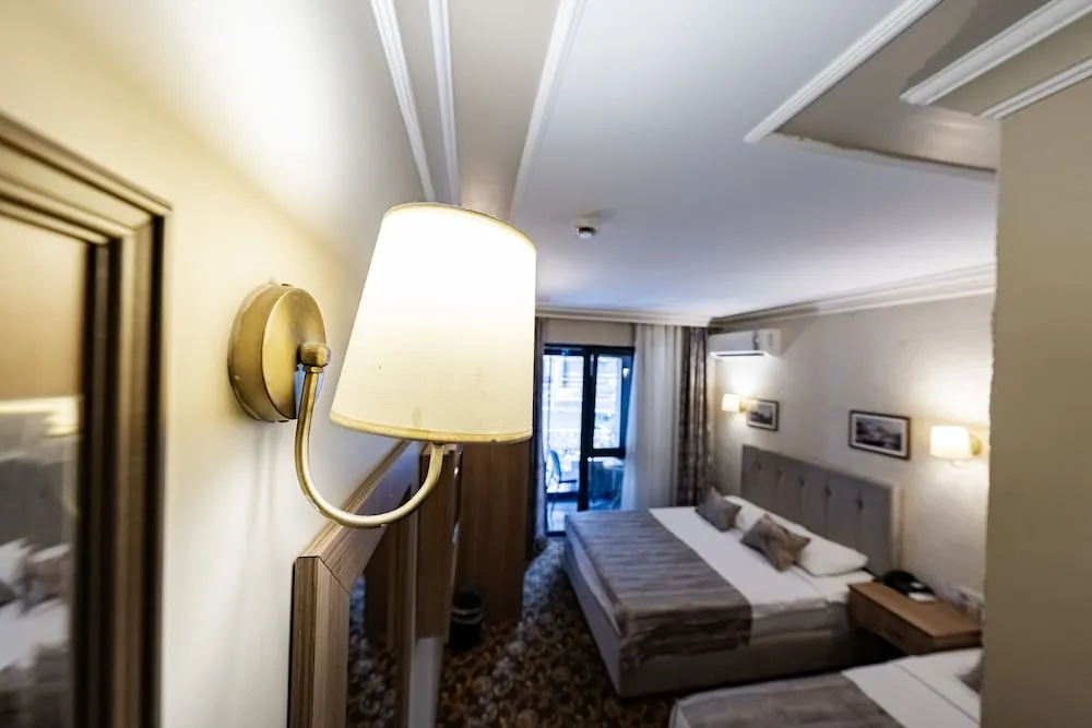 Standard Room - Trp Triple with City View and French Balcony