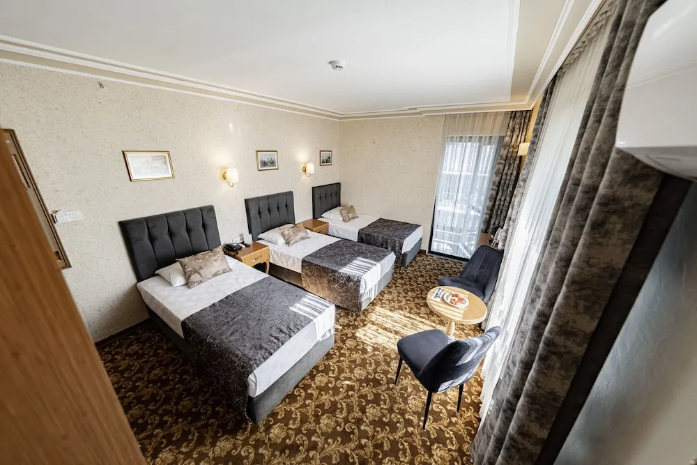 Standard Room - Trp Triple with City View and French Balcony