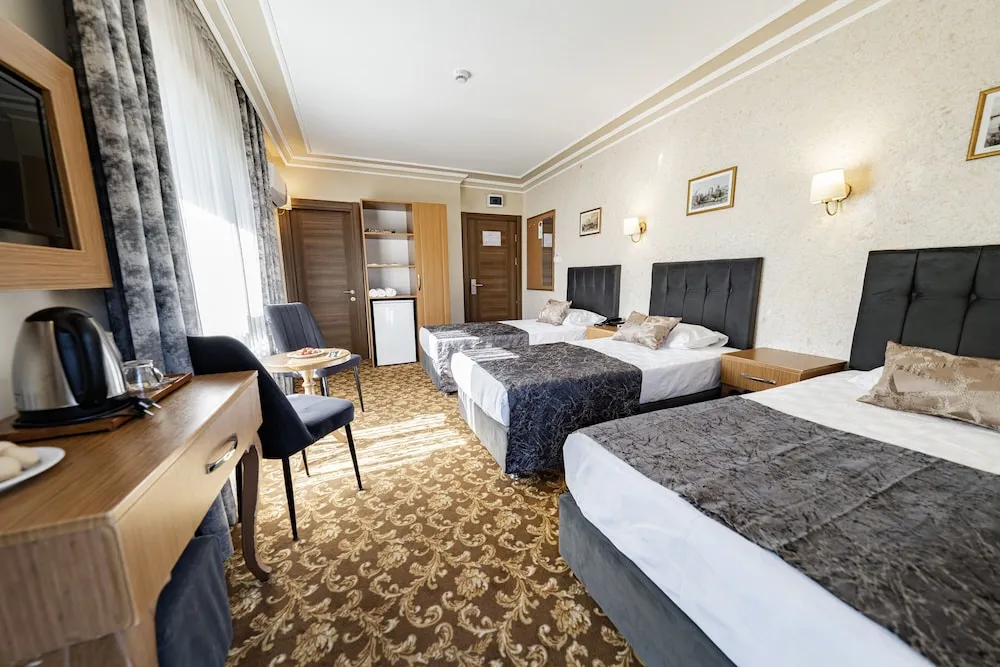 Standard Room - Trp Triple with City View and French Balcony