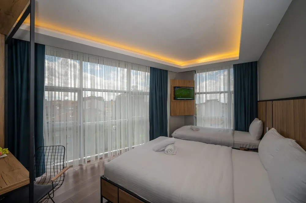 Deluxe Tek Büyük veya İki Ayrı Yataklı Oda