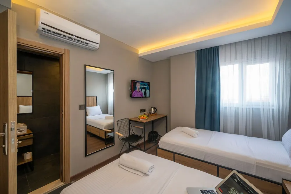 Deluxe Tek Büyük veya İki Ayrı Yataklı Oda