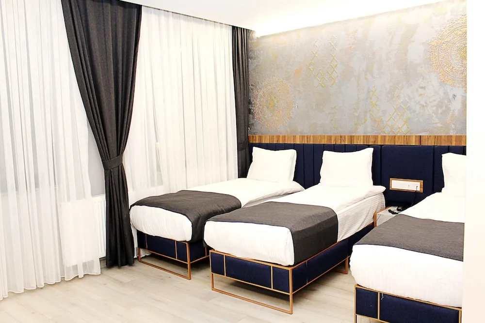 Deluxe Üç Kişilik Oda