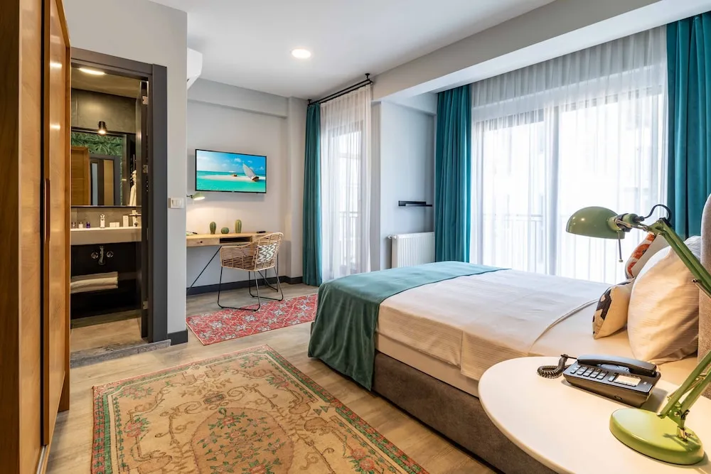 Deluxe Tek Büyük veya İki Ayrı Yataklı Oda