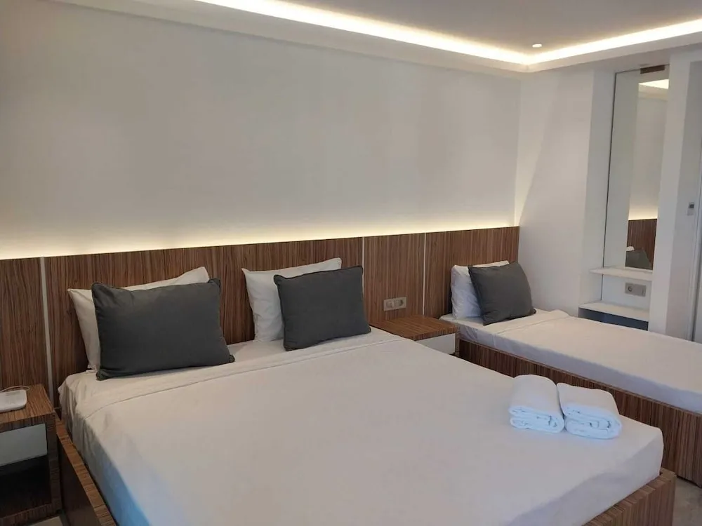 Deluxe Üç Kişilik Oda, Birden Çok Yatak