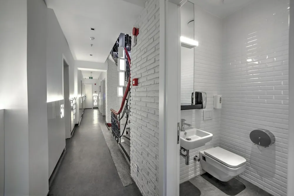 Bed in 4-Bed Dormitory Room with Shared Bathroom
