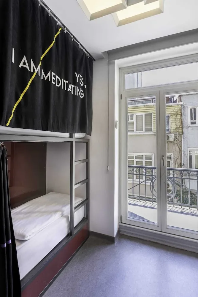 Bed in 4-Bed Dormitory Room with Shared Bathroom