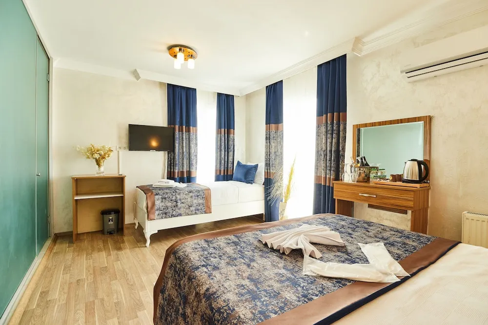 Deluxe Üç Kişilik Oda