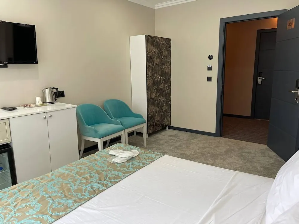 Deluxe Tek Büyük Yataklı Oda, Kısmi Deniz Manzaralı