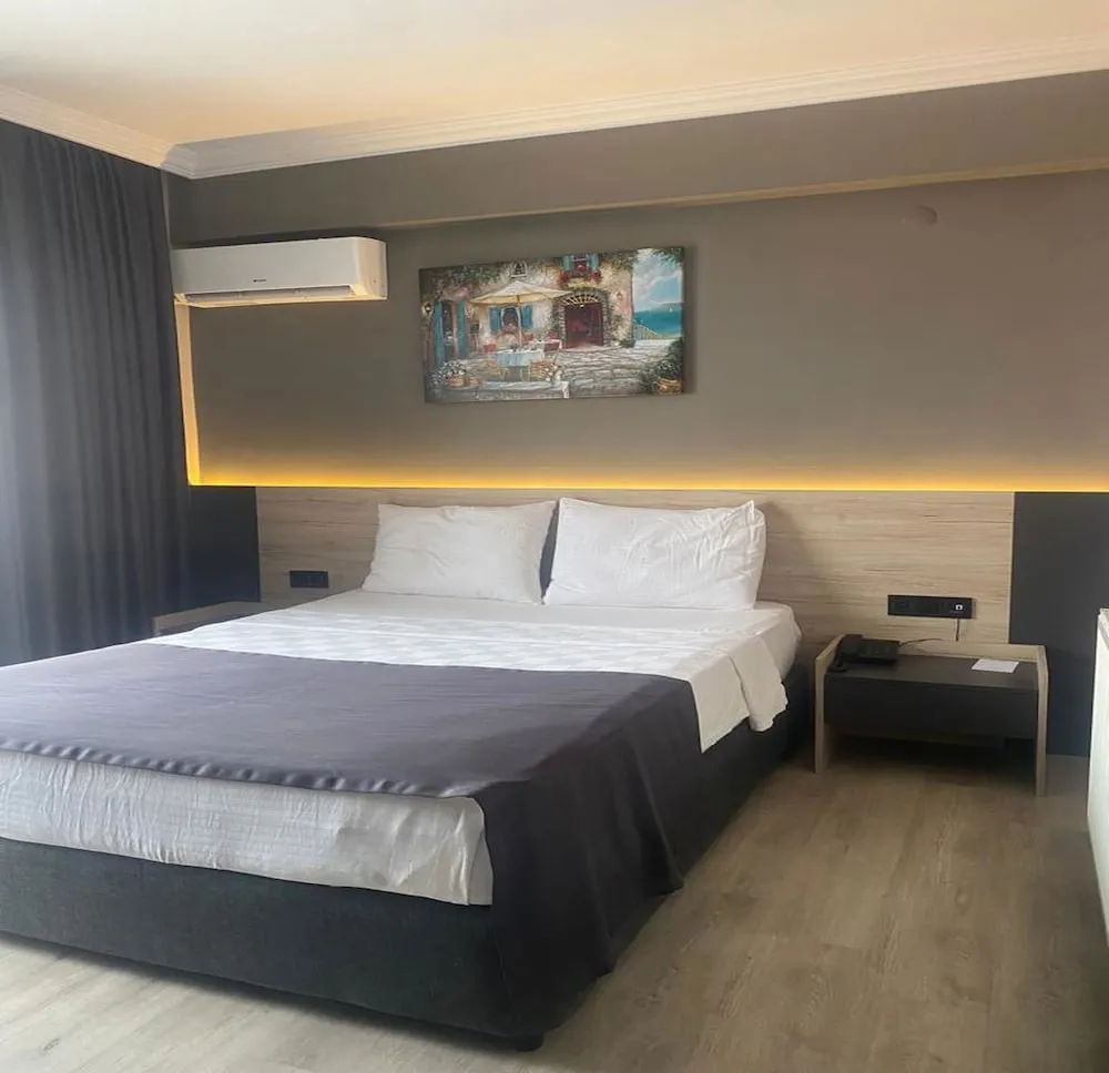 Deluxe Tek Büyük veya İki Ayrı Yataklı Oda