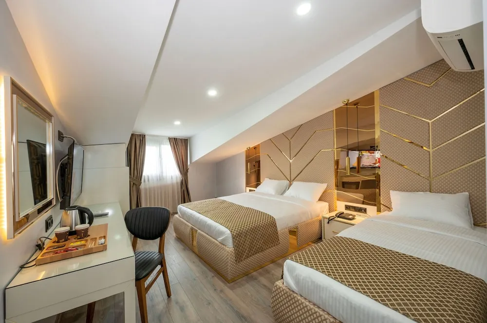 Deluxe Üç Kişilik Oda