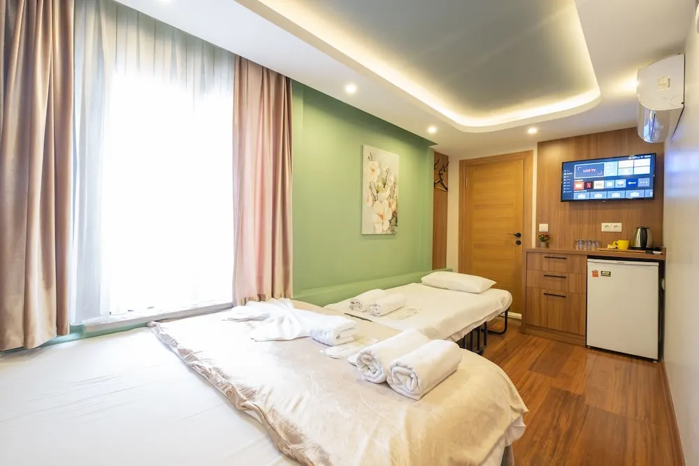 Deluxe Üç Kişilik Oda