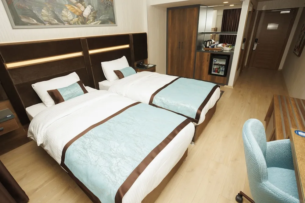 Deluxe Tek Büyük veya İki Ayrı Yataklı Oda