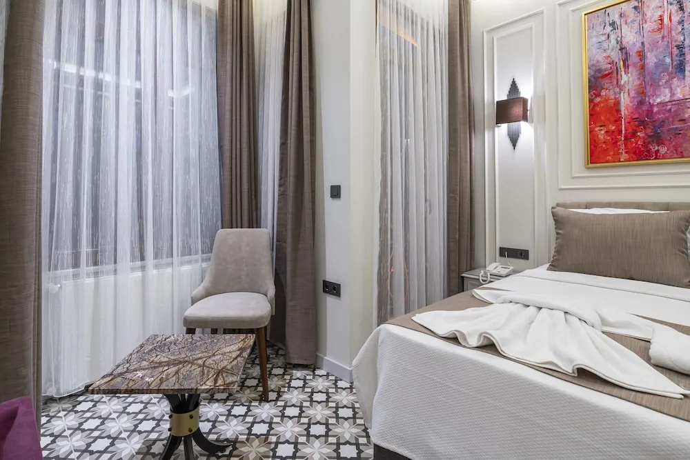 Deluxe Tek Büyük veya İki Ayrı Yataklı Oda