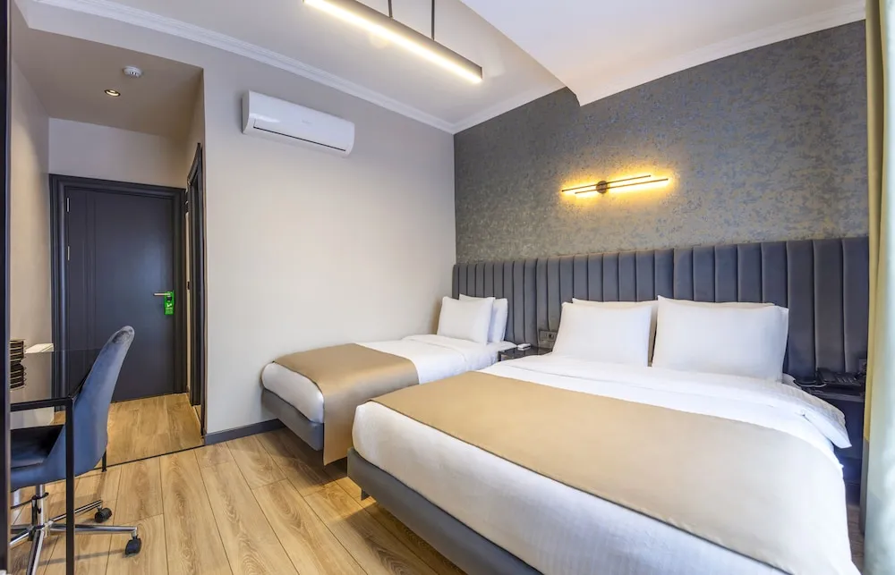 Deluxe Tek Büyük veya İki Ayrı Yataklı Oda