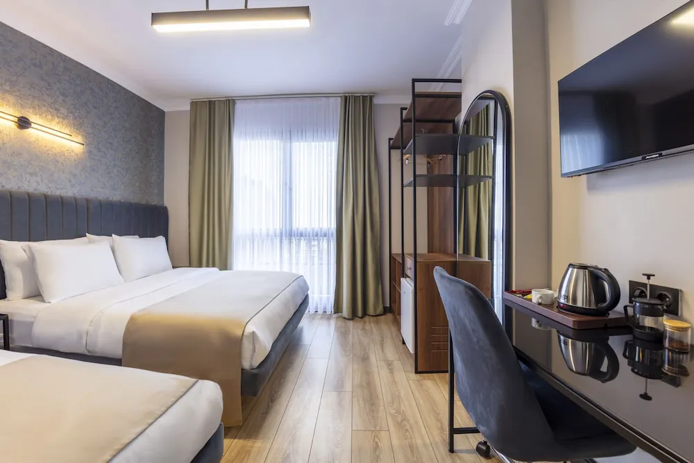 Deluxe Tek Büyük veya İki Ayrı Yataklı Oda