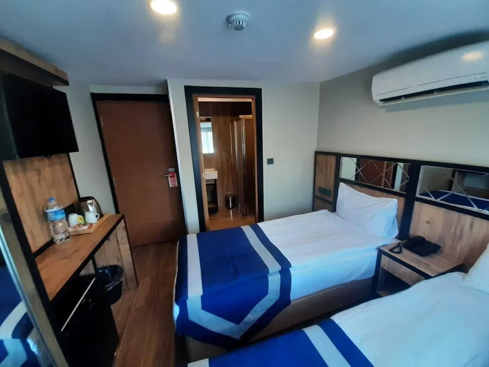 Deluxe Tek Büyük veya İki Ayrı Yataklı Oda