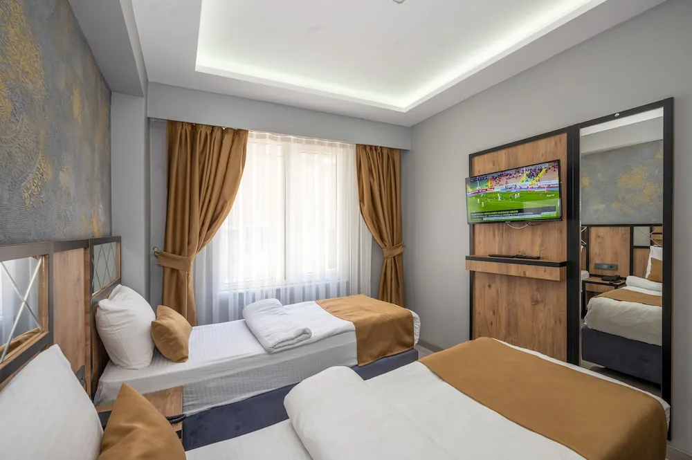 Deluxe Tek Büyük veya İki Ayrı Yataklı Oda