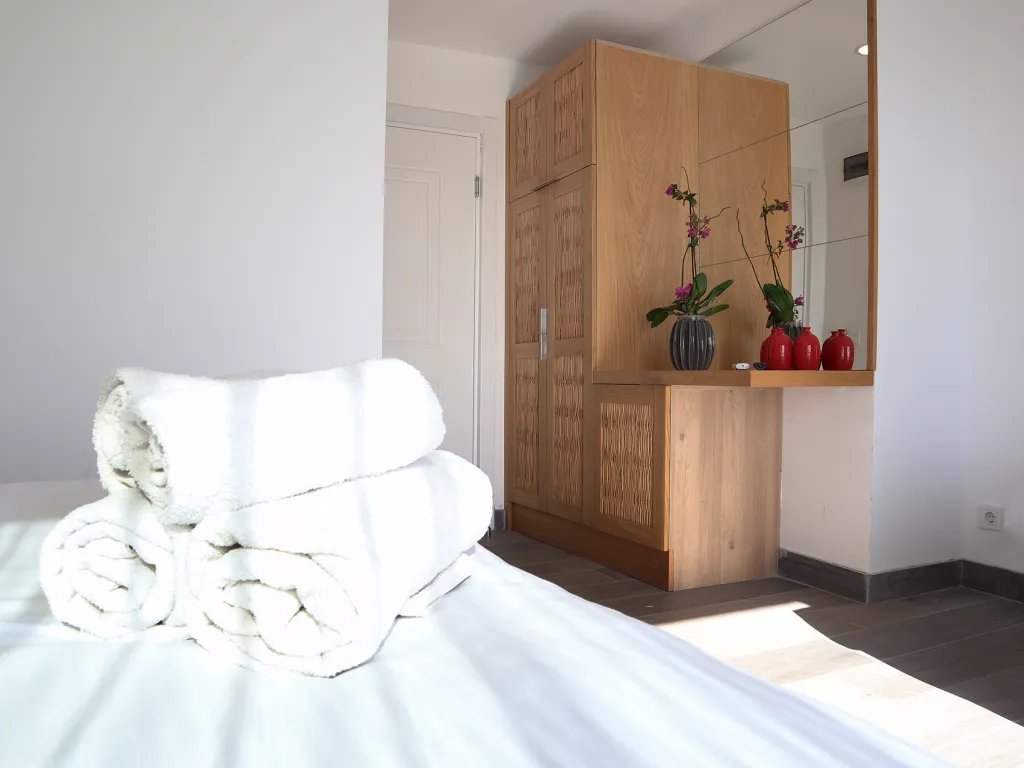A ROOM WITH A BALCONY OVERLOOKING THE SEA