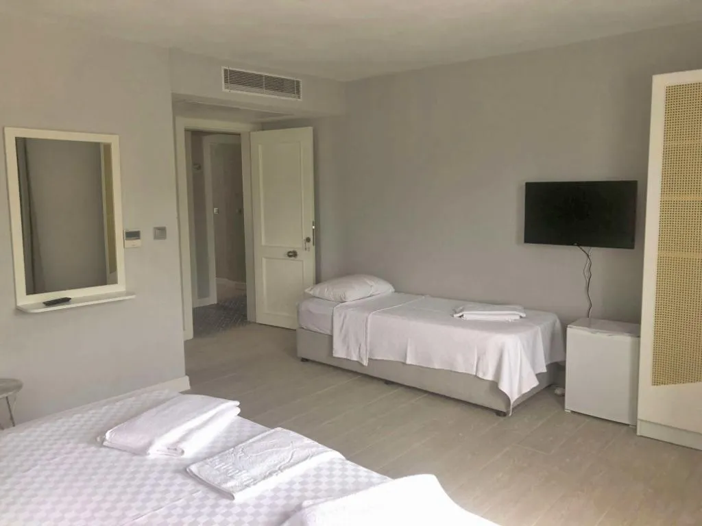 Deluxe Üç Kişilik Oda ,Bahçe Manzaralı