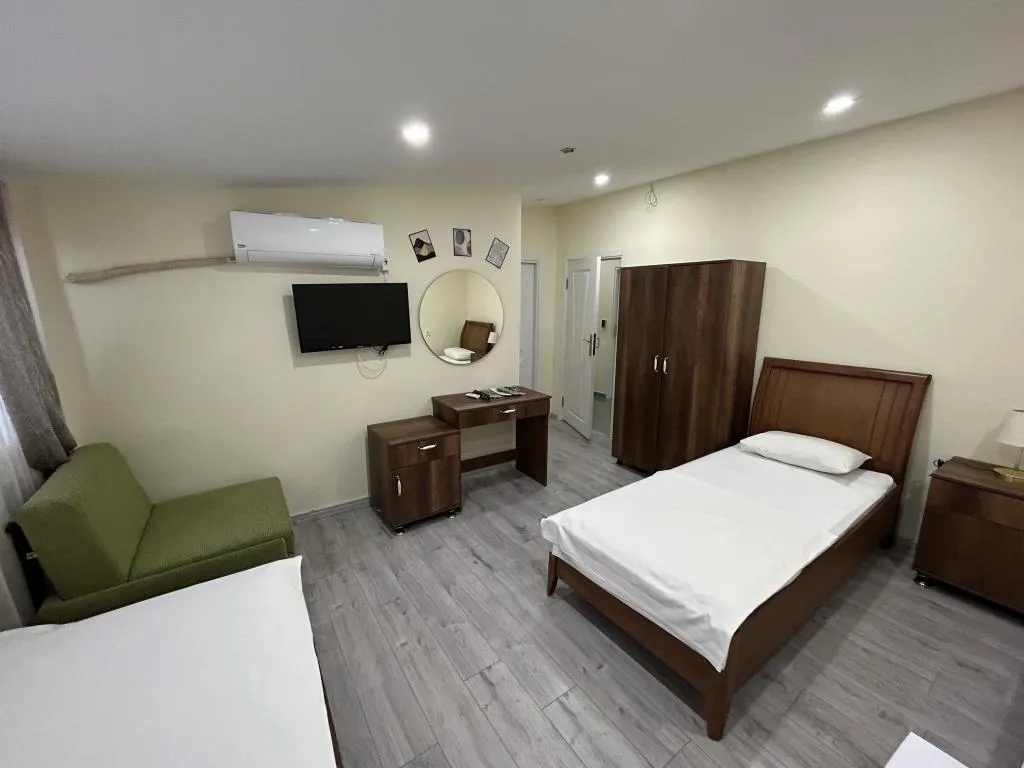 Deluxe Üç Kişilik Oda ,Deniz ve Şehir Manzaralı,Klimalı