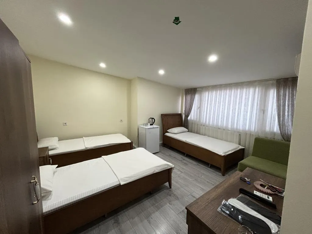 Deluxe Üç Kişilik Oda ,Deniz ve Şehir Manzaralı,Klimalı