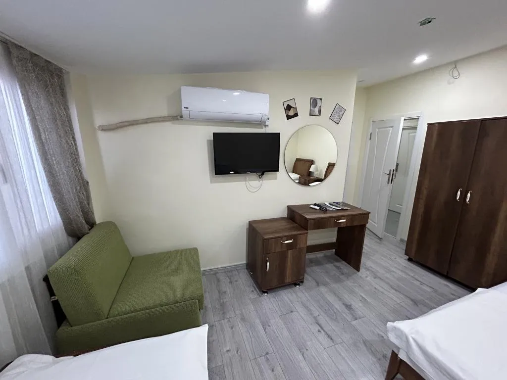 Deluxe Üç Kişilik Oda ,Deniz ve Şehir Manzaralı,Klimalı